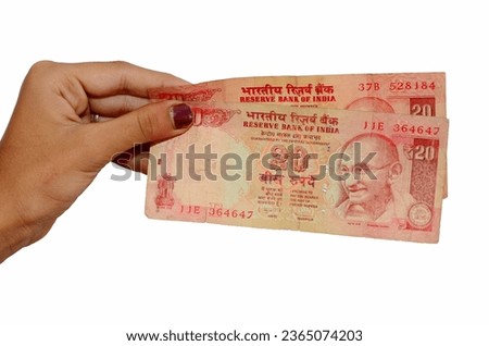 Lady Hand Hold Indian Old Currency 20 Rupees Note. Giving money to another person Twenty Rupees Note. Royalty-Free Stock Photo #2365074203