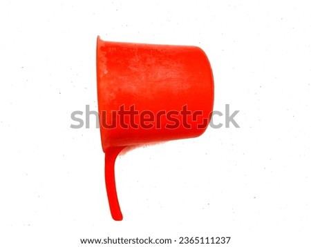 The plastic water scoop is bright red
