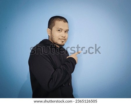Man in black jacket giving product promotion