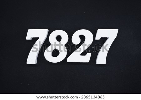 Black for the background. The number 7827 is made of white painted wood.