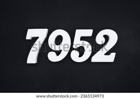 Black for the background. The number 7952 is made of white painted wood.