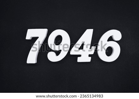 Black for the background. The number 7946 is made of white painted wood.