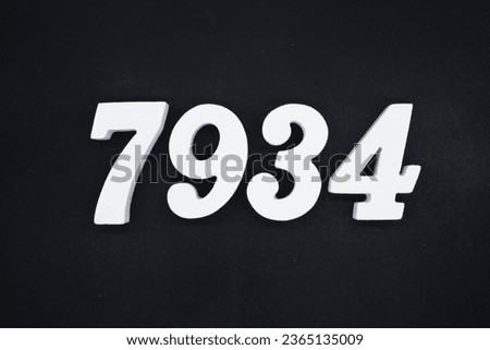 Black for the background. The number 7934 is made of white painted wood.