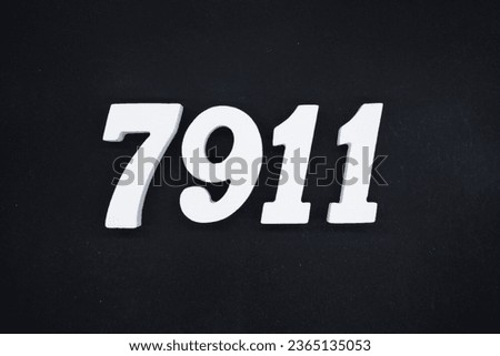 Black for the background. The number 7911 is made of white painted wood.