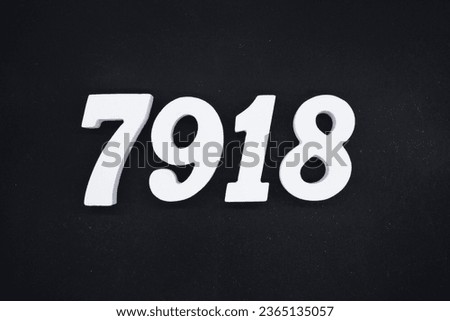 Black for the background. The number 7918 is made of white painted wood.