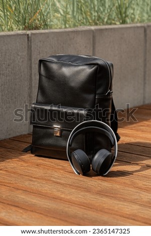 black leather backpack, industrial photography outdor