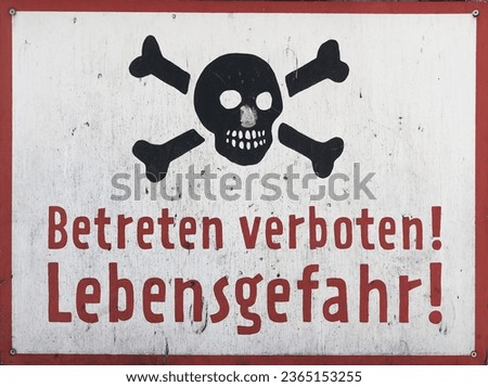  Hand painted sign on old company premises with german inscription Betreten verboten Lebensgefahr. Translation: Do not enter danger to life                               