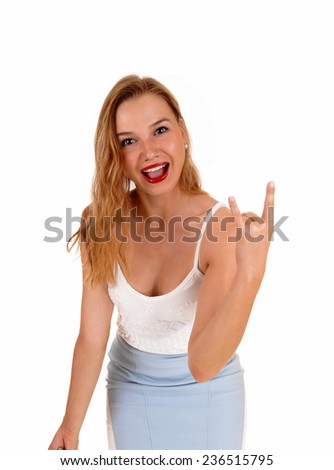 A lovely slim woman in a blue skirt and white top standing isolated for white background and giving the finger. 