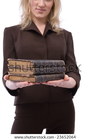 Businesswoman holding old law books on white