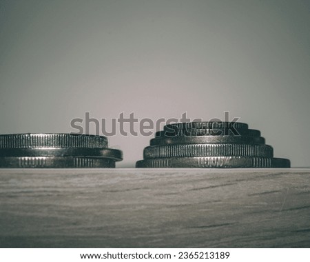 stack of coins on a wooden table
