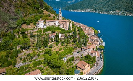 Aerial image of lake Lugano and Morcote landscape in Switzerland, autumn church of Santa Maria del Sasso and village Royalty-Free Stock Photo #2365223873