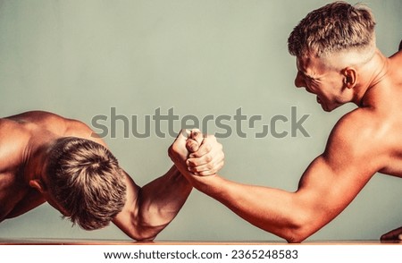 Hands or arms of man. Arm wrestling. Two men arm wrestling. Rivalry, closeup of male arm wrestling.