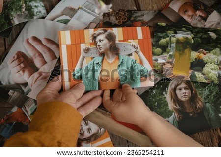 Young woman and kid selecting printed photos for family photo album.
