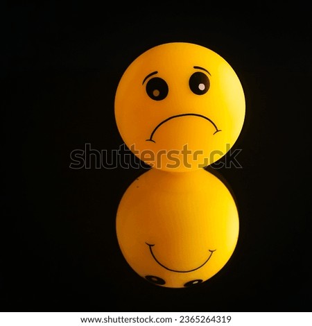 Sad yellow emoticon isolated in black background , copy space