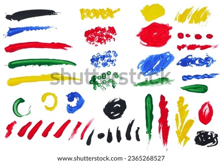 Various strokes of acrylic multicolored paint on an isolated background