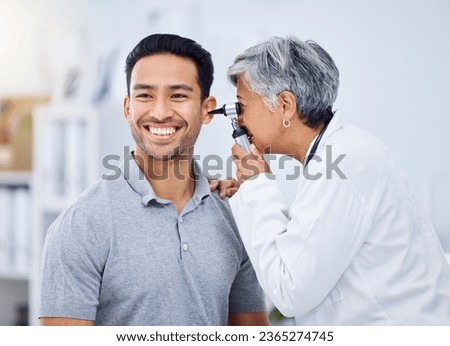 Doctor, patient or ear check for healthcare or wellness at hospital with otolaryngology specialist. Man, smile or senior physician woman with otoscope test for hearing problem or medical consultation Royalty-Free Stock Photo #2365274745