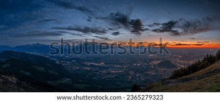 Sunset view from Gaisberg hill over Salzburg city in summer fresh hot evening