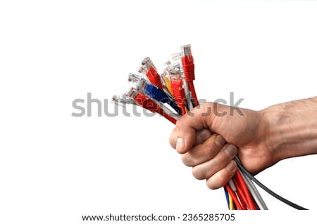 Network internet cable in hand isolated on black background