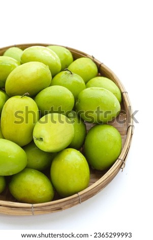 Green jujube fruits on white background. Royalty-Free Stock Photo #2365299993