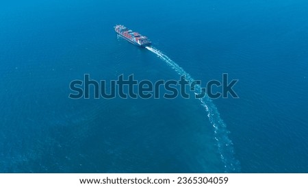 Stern of large cargo ship import export container box on the ocean sea on blue sky back ground concept transportation logistic and service to customer and supply change	


