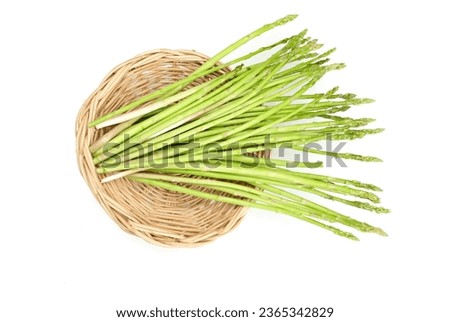 Fresh  green raw vegetables asparagus (Asparagus officinalis) in a wicker basket isolate on a white backdrop. Vegan healthy food.
vegetable for healthy nutrition