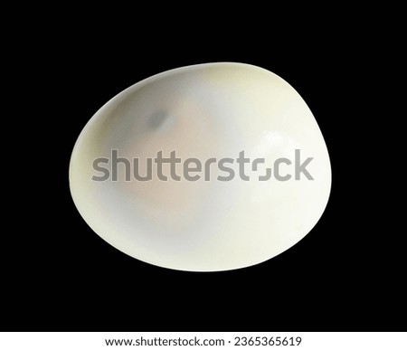Boiled egg isolated with clipping path, no shadow on black background, chicken egg