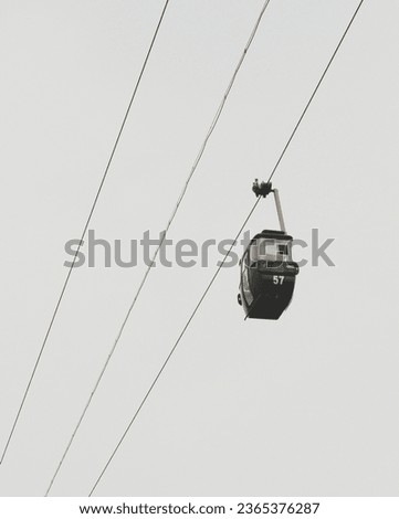 The cable car picture was taken while it was moving on the area of Beautiful Indonesia Mini Park.