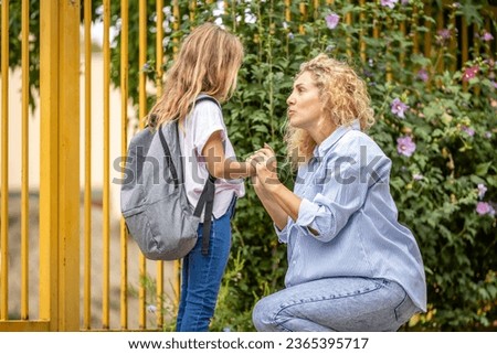 Parent giving support to the child before going to school.