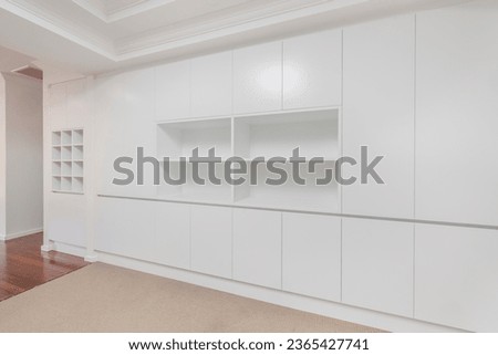 new modern joinery living lounge room interior cabinetry and new cornice with shelving and wine rack
 Royalty-Free Stock Photo #2365427741