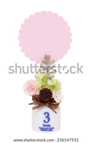 Clamp holding blank card with handmade decoration 