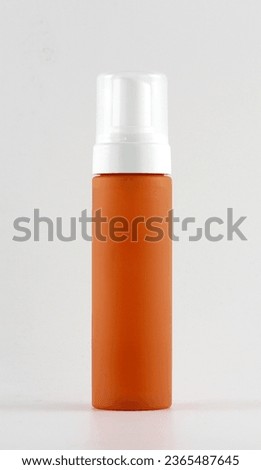Orange Plastic Bottle In white background - Product Photography Royalty-Free Stock Photo #2365487645