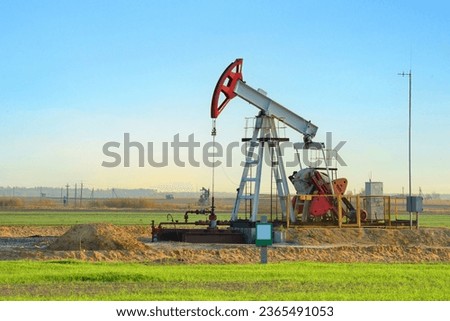 Oil prices on global market. Crude oil Pumpjack on oilfield on sunset. Fossil crude production. Oil drill rig and drilling derrick. Global crude oil Prices, petroleum demand OPEC+. Pump jack, oilfield Royalty-Free Stock Photo #2365491053