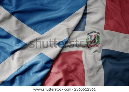 big waving national colorful flag of scotland and national flag of dominican republic . macro