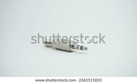 Audio signal converters earphone stereo jack type, in the foreground and on white background