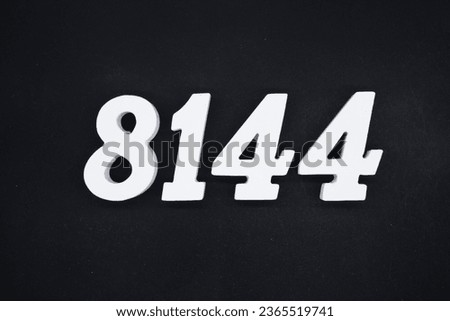Black for the background. The number 8144 is made of white painted wood.