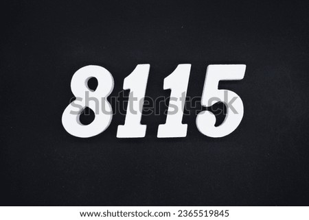 Black for the background. The number 8115 is made of white painted wood.