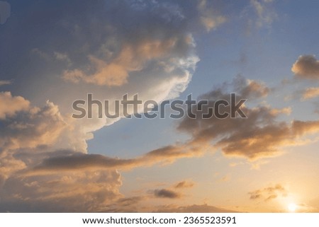 Thunderstorm clouds in the sky at sunset texture background overlay. Dramatic cumulonimbus image. High resolution photography perfect for sky replacement