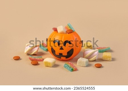 Halloween Jelly Beans. Happy Halloween Party Border Beige Background. Aesthetic Accessories Banner. Spooky Orange Pumpkin Candy Bucket. Modern Holiday Design. Thanksgiving Trendy Fall Poster