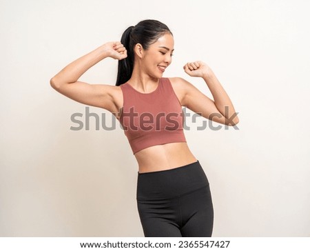 Young beautiful smiling asian woman with sportswear dancing happy by her body shape feels good and comfortable. Portrait happy healthy slim fit and firm latin attractive sporty woman exercise workout
