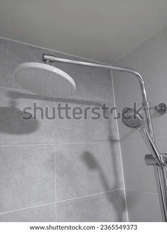 White shower overlooking the shadow of a lotus, picture of the atmosphere in the bathroom
