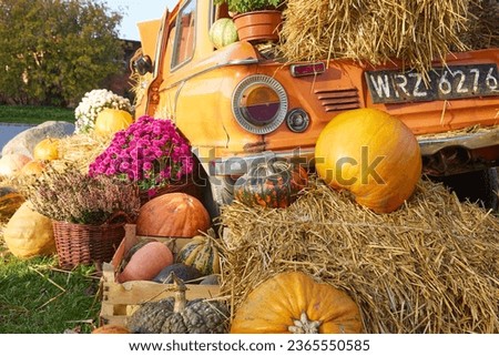 A fall harvest festival, the decorations created with hay pumpkins are just as indicative of the coming fall and approaching Halloween Royalty-Free Stock Photo #2365550585