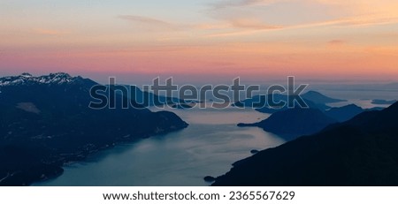 Canadian Mountain Landscape on the West Coast of Pacific Ocean. Aerial Nature Background. Sunset Sky. Howe Sound, British Columbia, Canada. Royalty-Free Stock Photo #2365567629