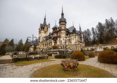 Beautiful Peles Castle and ornamental garden in Sinaia landmark of Carpathian Mountains in Europe.