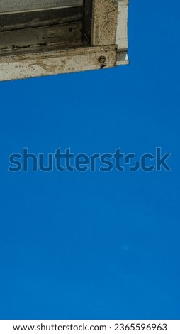 Photos of the roof of the house with a blue sky background, suitable to be used as wallpaper