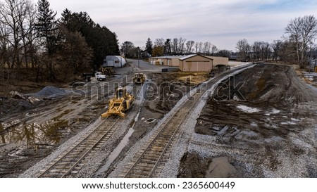 A Drone View of a Train Freight Yard being Constructed With New Railroad Tracks and Switches