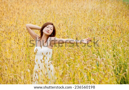 young lady portrait in the  cornfield