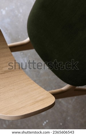 Single light wooden stool with deep green cushion