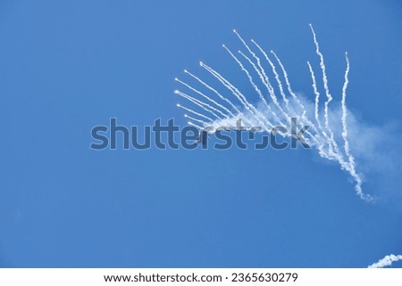 Cleveland National Airshow. Burke Lakefront Airport. September 3, 2023. US Air Force F-22 Raptor Fighter Jet ejecting anti-missile flares Royalty-Free Stock Photo #2365630279