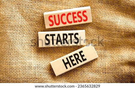 Success starts here symbol. Concept word Success starts here on beautiful wooden block. Beautiful canvas table canvas background. Business motivational success starts here concept. Copy space. Royalty-Free Stock Photo #2365632829