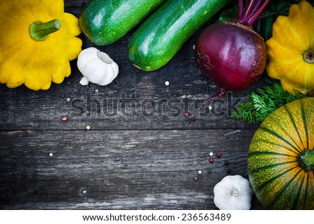 Fresh organic seasonal vegetables - pumpkin, squash, beetroot on wooden background